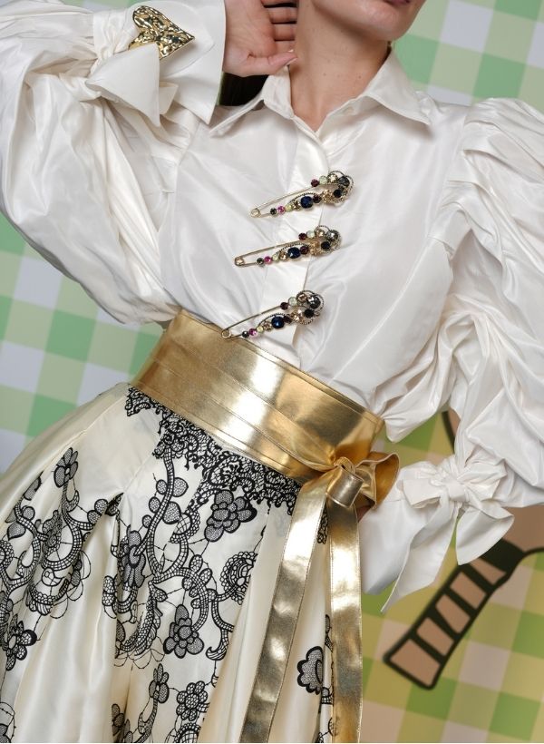 WHITE SAFETY PIN SHIRT PAIRED WITH SATIN LACE FLARED PANTS